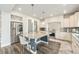 Modern kitchen featuring stainless steel appliances, a large island with bar seating and granite countertops at 4981 Liverpool St, Denver, CO 80249