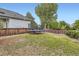 Backyard featuring a large trampoline and a wooden fence for privacy at 11029 Grouse Ct, Parker, CO 80134