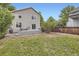 Backyard featuring a well-maintained lawn, a wooden fence and a deck at 11029 Grouse Ct, Parker, CO 80134