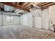 Unfinished basement featuring exposed pipes and ducts, a window, carpet and stairs at 11029 Grouse Ct, Parker, CO 80134