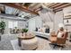 Finished basement with stylish seating and a dining area at 11029 Grouse Ct, Parker, CO 80134