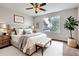 Cozy bedroom with a plush bed, neutral decor, and ample natural light creating a serene atmosphere at 11029 Grouse Ct, Parker, CO 80134