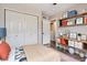 Bright bedroom boasts closet, desk, and wood floors at 11029 Grouse Ct, Parker, CO 80134