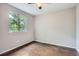 Bedroom featuring hardwood floors and a window at 11029 Grouse Ct, Parker, CO 80134