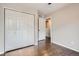 Bedroom featuring hardwood floors and closet at 11029 Grouse Ct, Parker, CO 80134