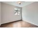 Bedroom featuring hardwood floors, a ceiling fan and a window at 11029 Grouse Ct, Parker, CO 80134