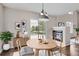 Charming dining area with a round table, modern lighting, and a view of the outdoors at 11029 Grouse Ct, Parker, CO 80134