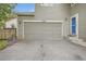 Home exterior showing two-car garage and entryway to the home at 11029 Grouse Ct, Parker, CO 80134