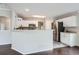 Open kitchen with white cabinets and stainless steel appliances and plenty of counterspace at 11029 Grouse Ct, Parker, CO 80134