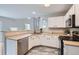 Bright kitchen with stainless steel appliances and white cabinets at 11029 Grouse Ct, Parker, CO 80134
