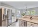 Bright kitchen with stainless steel appliances, white cabinets, and a functional layout at 11029 Grouse Ct, Parker, CO 80134