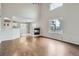 Cozy living room with fireplace and open view to the kitchen and dining area at 11029 Grouse Ct, Parker, CO 80134