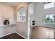 Open concept living area with fireplace and rich, wood-look floors at 11029 Grouse Ct, Parker, CO 80134