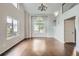 Bright living room featuring hardwood floors, chandelier, and vaulted ceiling at 11029 Grouse Ct, Parker, CO 80134