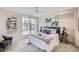 Serene bedroom featuring a plush bed, stylish decor, and abundant natural light from the large windows at 2323 S High St, Denver, CO 80210