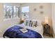 Bright bedroom featuring modern décor, lots of natural light, and comfortable furnishings for a relaxing retreat at 2323 S High St, Denver, CO 80210
