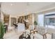 Bright, modern kitchen with an island that includes space for barstool seating, stainless appliances and wood cabinetry at 2323 S High St, Denver, CO 80210