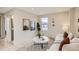 Cozy living room with neutral colors, hardwood floors, modern decor and ample natural light from the large window at 2323 S High St, Denver, CO 80210