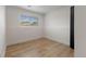 Bedroom featuring wood-look floors and a window for natural light at 18396 E Mexico Pl, Aurora, CO 80017
