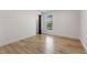 Bright bedroom with wood-look floors, window, and a closet for storage at 18396 E Mexico Pl, Aurora, CO 80017