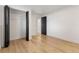 Spacious bedroom with wood-look floors and a closet for organized storage at 18396 E Mexico Pl, Aurora, CO 80017