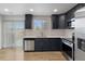 Modern kitchen with stainless steel appliances, sleek countertops, and access to the outdoor patio at 18396 E Mexico Pl, Aurora, CO 80017