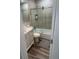 Bathroom featuring a shower-tub combination and marble tile surround at 10010 Columbine Ct, Thornton, CO 80229