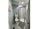 Bathroom featuring a toilet, cabinet, and shower at 10010 Columbine Ct, Thornton, CO 80229