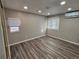 Bedroom with a window for natural light and hardwood floors at 10010 Columbine Ct, Thornton, CO 80229