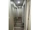 Neutral hallway featuring wood-look flooring, mirrored closet doors, and recessed lighting at 10010 Columbine Ct, Thornton, CO 80229