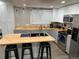 Modern kitchen with butcher block countertops, white cabinets, and stainless steel appliances at 10010 Columbine Ct, Thornton, CO 80229