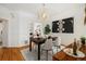 Open dining area featuring a modern light fixture with easy access to other rooms at 1748 W 36Th Ave, Denver, CO 80211