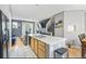 Kitchen with stainless steel appliances and a connecting living space at 9484 E 108Th Ave, Commerce City, CO 80640
