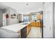 Spacious kitchen with a large island, stainless steel appliances, and tile flooring at 9484 E 108Th Ave, Commerce City, CO 80640