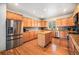 Well-equipped kitchen with stainless steel appliances, granite countertops, and hardwood floors at 1155 S Balsam St, Lakewood, CO 80232