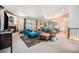 Spacious living room featuring a fireplace, vaulted ceilings, and a comfortable seating arrangement at 1155 S Balsam St, Lakewood, CO 80232