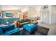 Open concept living room with vaulted ceilings, plush seating, and stylish decor at 1155 S Balsam St, Lakewood, CO 80232