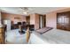 Bedroom featuring a large desk, ceiling fan, wood doors and wall-to-wall carpet at 8862 E Amherst Dr # D, Denver, CO 80231