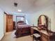 Basement bedroom featuring decorative furnishings, window for light, and access to the home's other spaces at 8862 E Amherst Dr # D, Denver, CO 80231