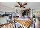 Cozy dining area with a rustic table, adjacent to the kitchen and well-lit living space at 8862 E Amherst Dr # D, Denver, CO 80231