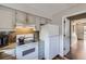 Kitchen featuring stainless steel appliances, a tile backsplash, and light colored cabinets at 8862 E Amherst Dr # D, Denver, CO 80231