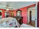 Main bedroom showing stylish wall decor, a ceiling fan and closet with mirrored doors at 8862 E Amherst Dr # D, Denver, CO 80231