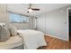 Bedroom featuring hardwood floors, a ceiling fan, and a window with natural light at 3047 W 47Th Ave # 112, Denver, CO 80211