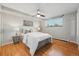 Cozy bedroom with hardwood floors, ample natural light, and a ceiling fan, creating a comfortable and inviting space to relax at 3047 W 47Th Ave # 112, Denver, CO 80211