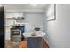 Well-lit kitchen with stainless steel appliances and modern finishes, creating a functional and aesthetically pleasing culinary space at 3047 W 47Th Ave # 112, Denver, CO 80211
