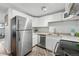 Modern kitchen with stainless steel appliances, ample cabinet space, and a clean design, perfect for culinary enthusiasts at 3047 W 47Th Ave # 112, Denver, CO 80211