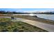 Scenic view of a lake from a bench along a paved pathway, perfect for outdoor enjoyment at 3047 W 47Th Ave # 112, Denver, CO 80211