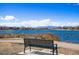 Picturesque lake view featuring a bench along the water, providing serene outdoor seating at 3047 W 47Th Ave # 112, Denver, CO 80211