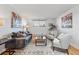 Inviting living room with hardwood floors, a cozy seating area, and natural light, ideal for comfortable living and relaxation at 3047 W 47Th Ave # 112, Denver, CO 80211
