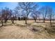 Expansive grassy park featuring picnic tables and mature trees offering shade on a sunny day at 3047 W 47Th Ave # 112, Denver, CO 80211